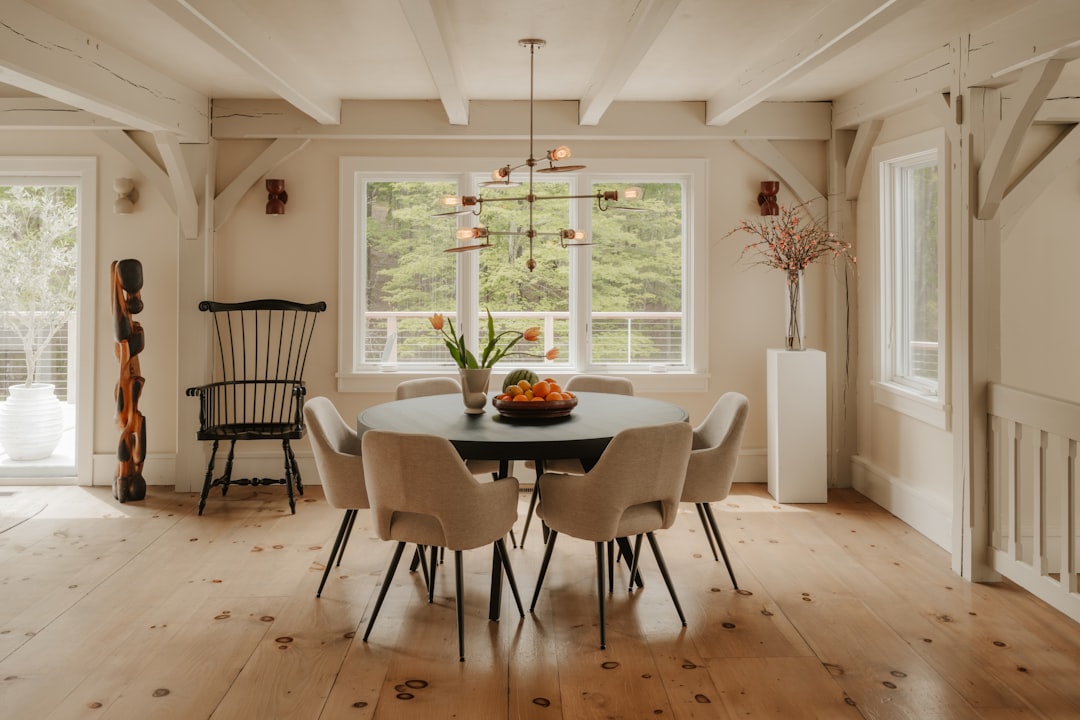 Elegantly finished hardwood dining table with warm natural wood grain in afternoon light